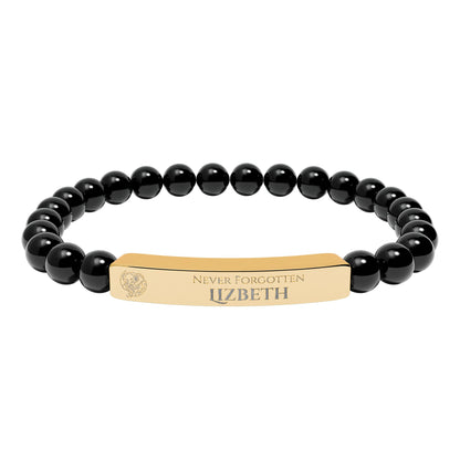 A natural stone bead engraved bracelet, personalized, with the text "Never Forgotten" with engraved elephant