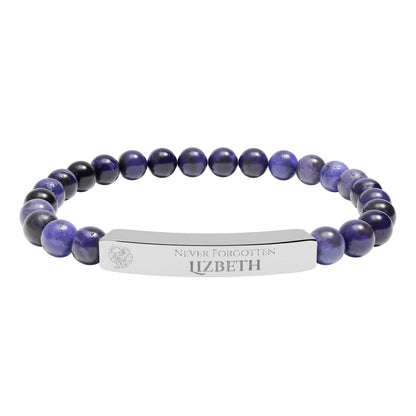 A natural stone bead engraved bracelet, personalized, with the text "Never Forgotten" with engraved elephant