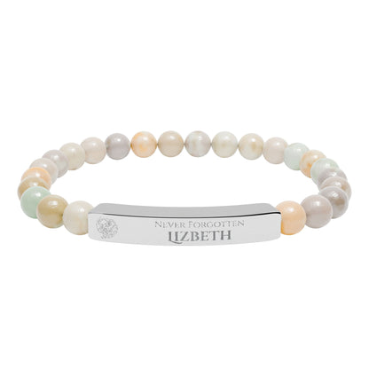 A natural stone bead engraved bracelet, personalized, with the text "Never Forgotten" with engraved elephant