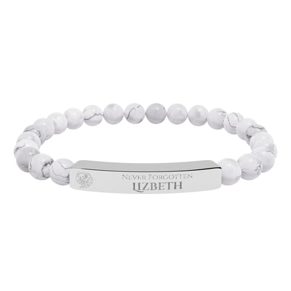 A natural stone bead engraved bracelet, personalized, with the text "Never Forgotten" with engraved elephant