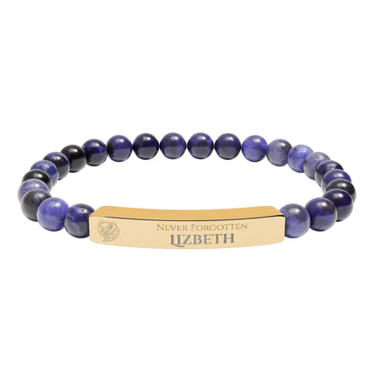 A natural stone bead engraved bracelet, personalized, with the text "Never Forgotten" with engraved elephant
