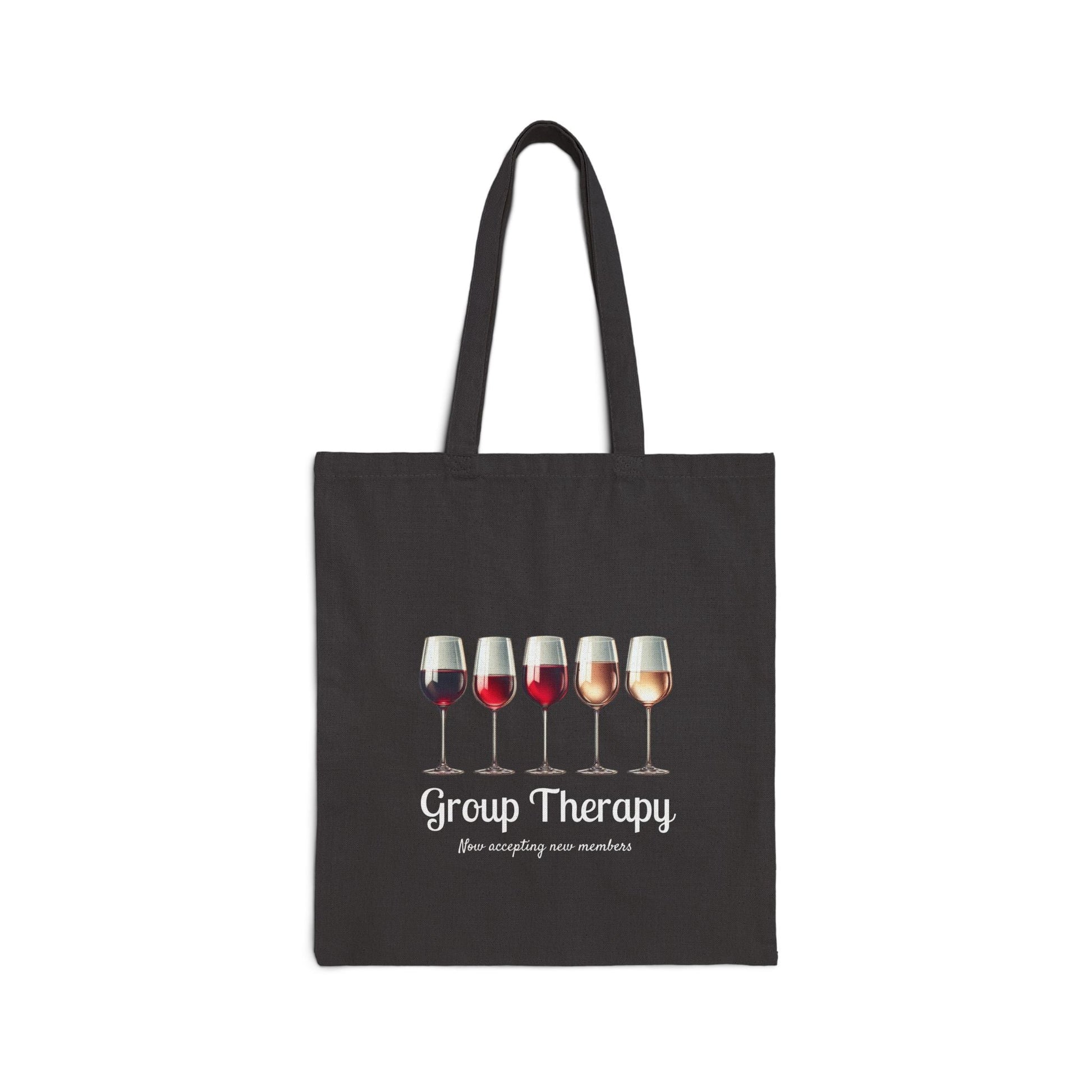 A dark tote bag featuring five wine glasses in assorted colors with the text "Group Therapy" and "now accepting new members"